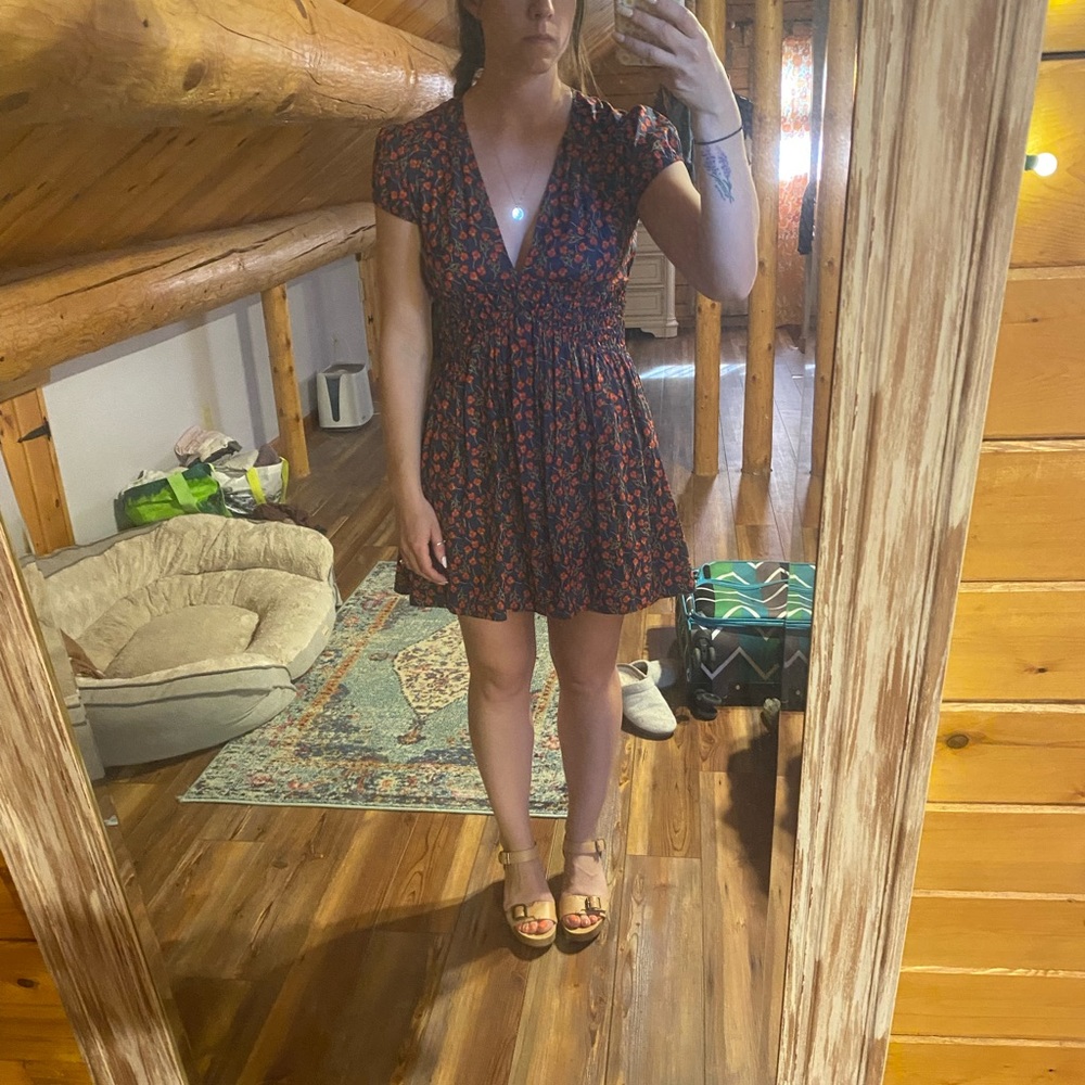 Free people mini dress size 4. Open back, plunging neckline. Lightly warn.